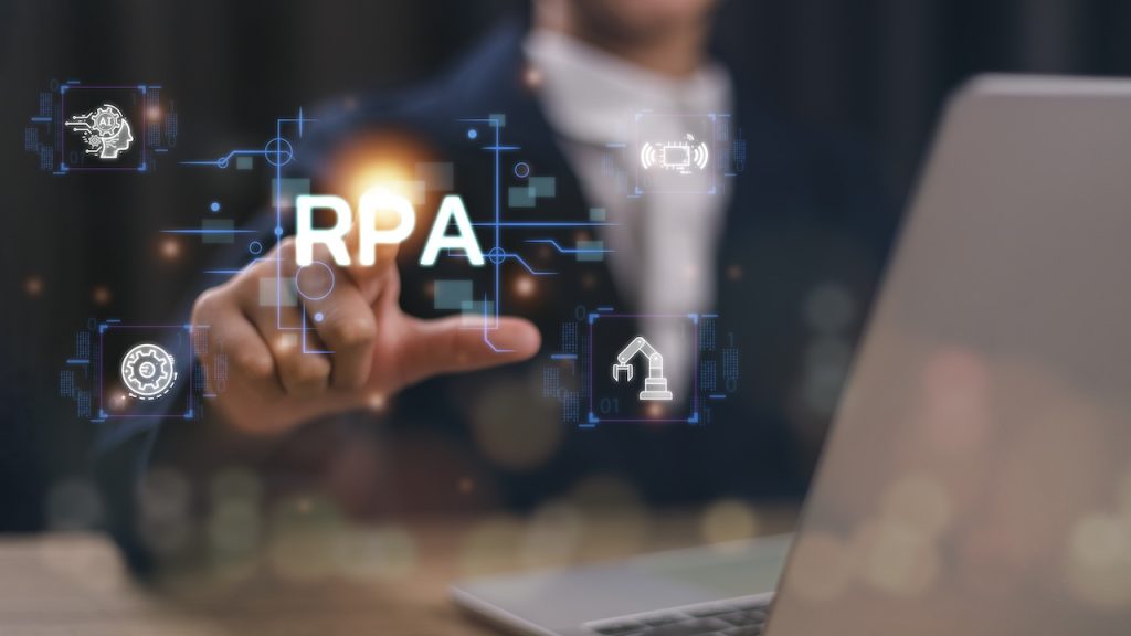 male hand touching a screen with the letters RPA in white